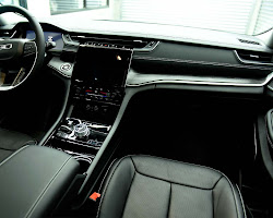 Luxury truck with a panoramic sunroof and a large touchscreen infotainment system